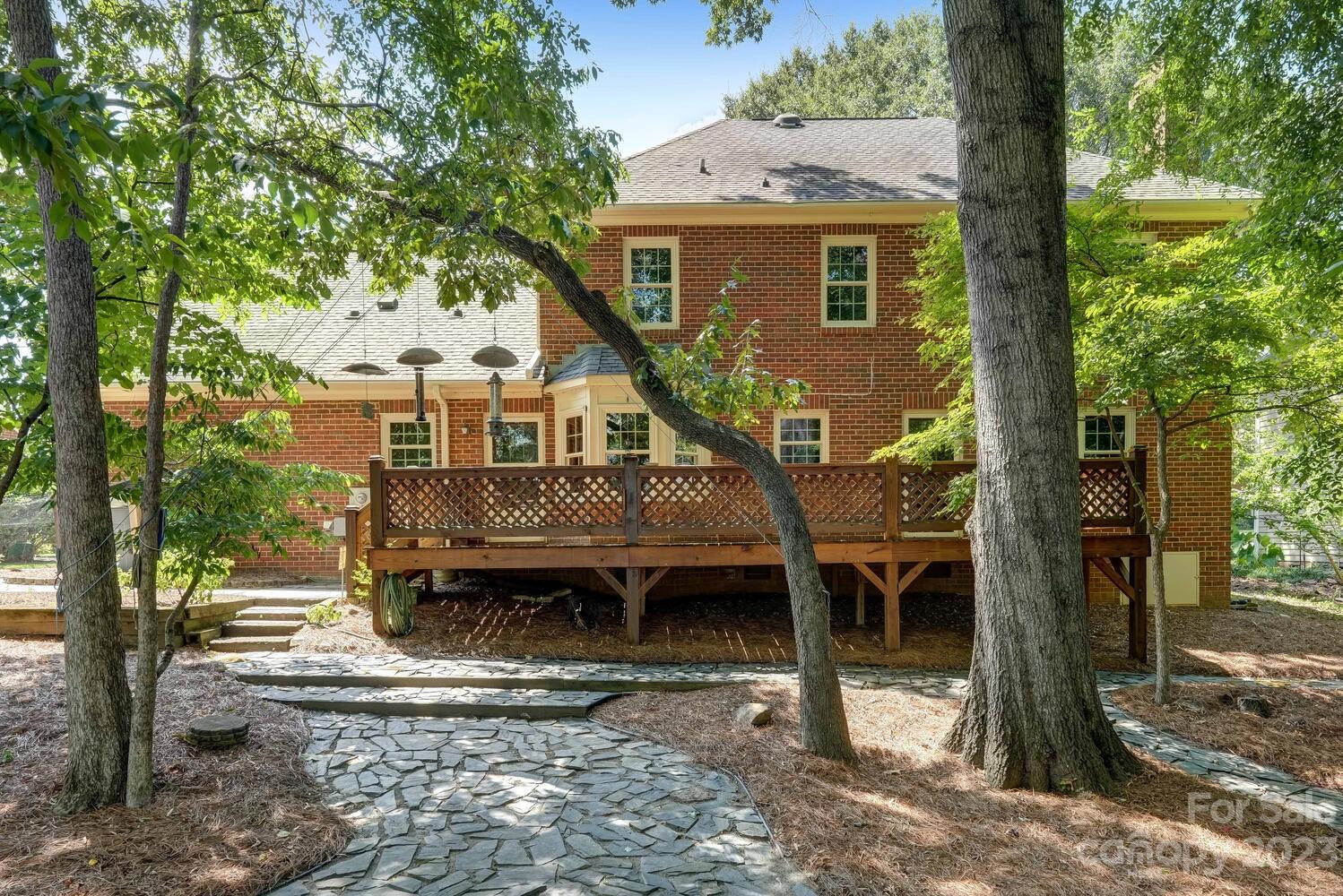 10215 Hanover Glen Road Charlotte, NC 28210 - Photo 36 of 40 a front view of a house with garden
