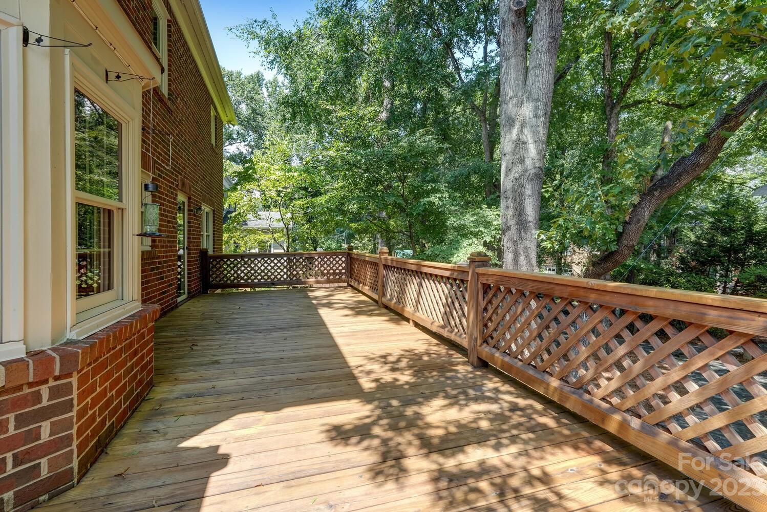 10215 Hanover Glen Road Charlotte, NC 28210 - Photo 37 of 40 a view of balcony with wooden floor and fence