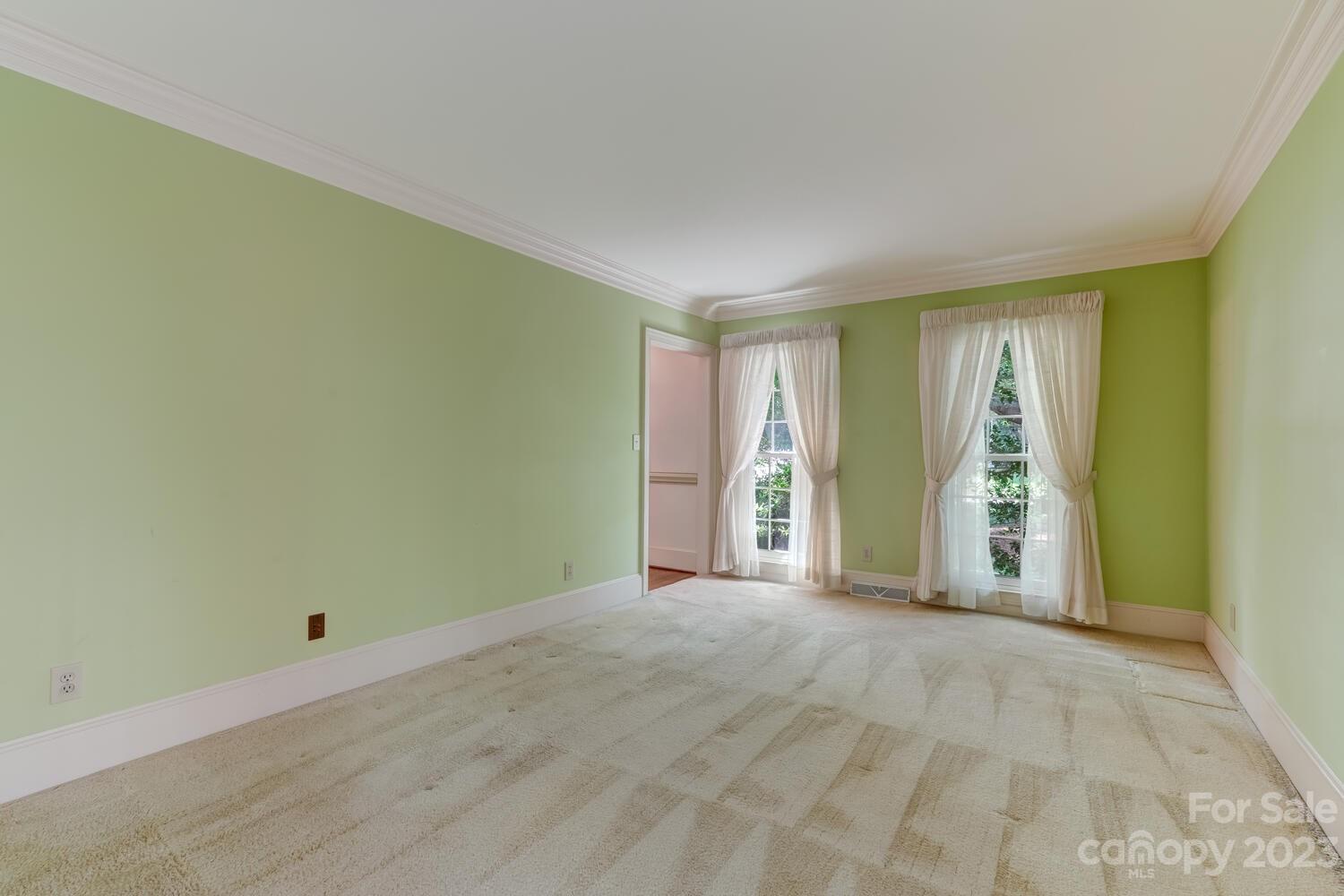10215 Hanover Glen Road Charlotte, NC 28210 - Photo 7 of 40 a view of an empty room with a window