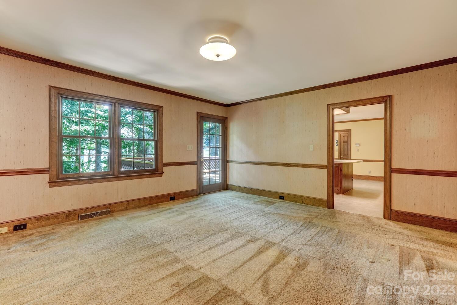 10215 Hanover Glen Road Charlotte, NC 28210 - Photo 9 of 40 a view of an empty room with a window