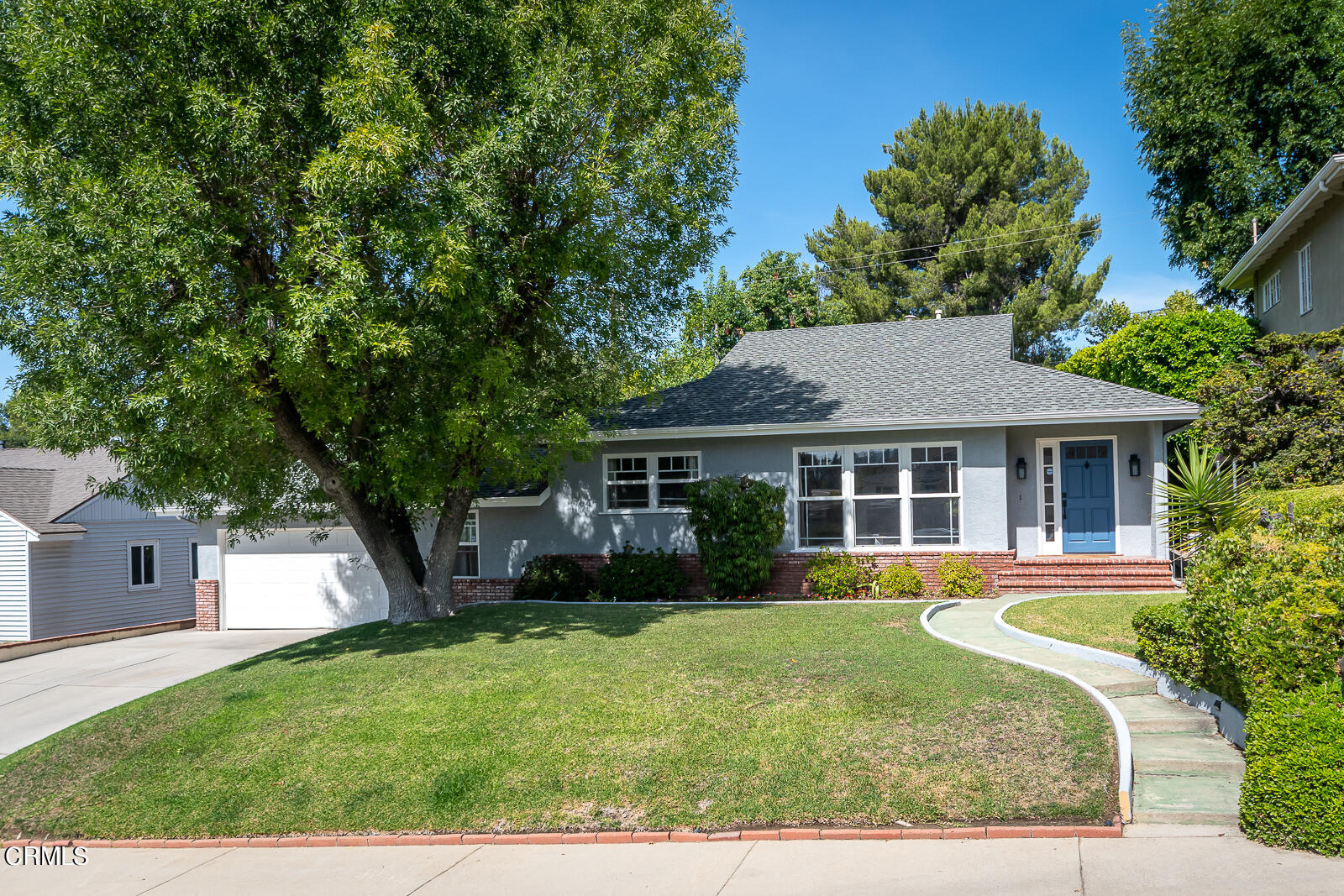 front view of a house with a yard