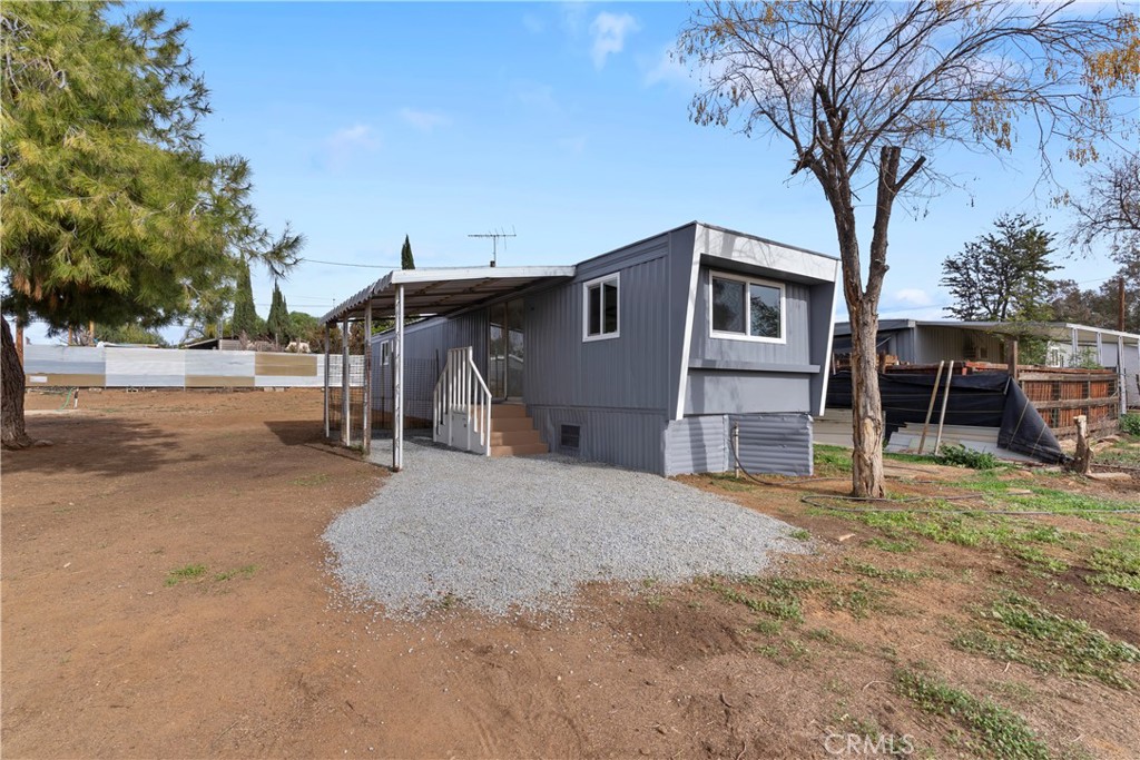 19610 Gustin Road Perris, CA 92570 - Photo 1 of 1 a house with trees in front of it