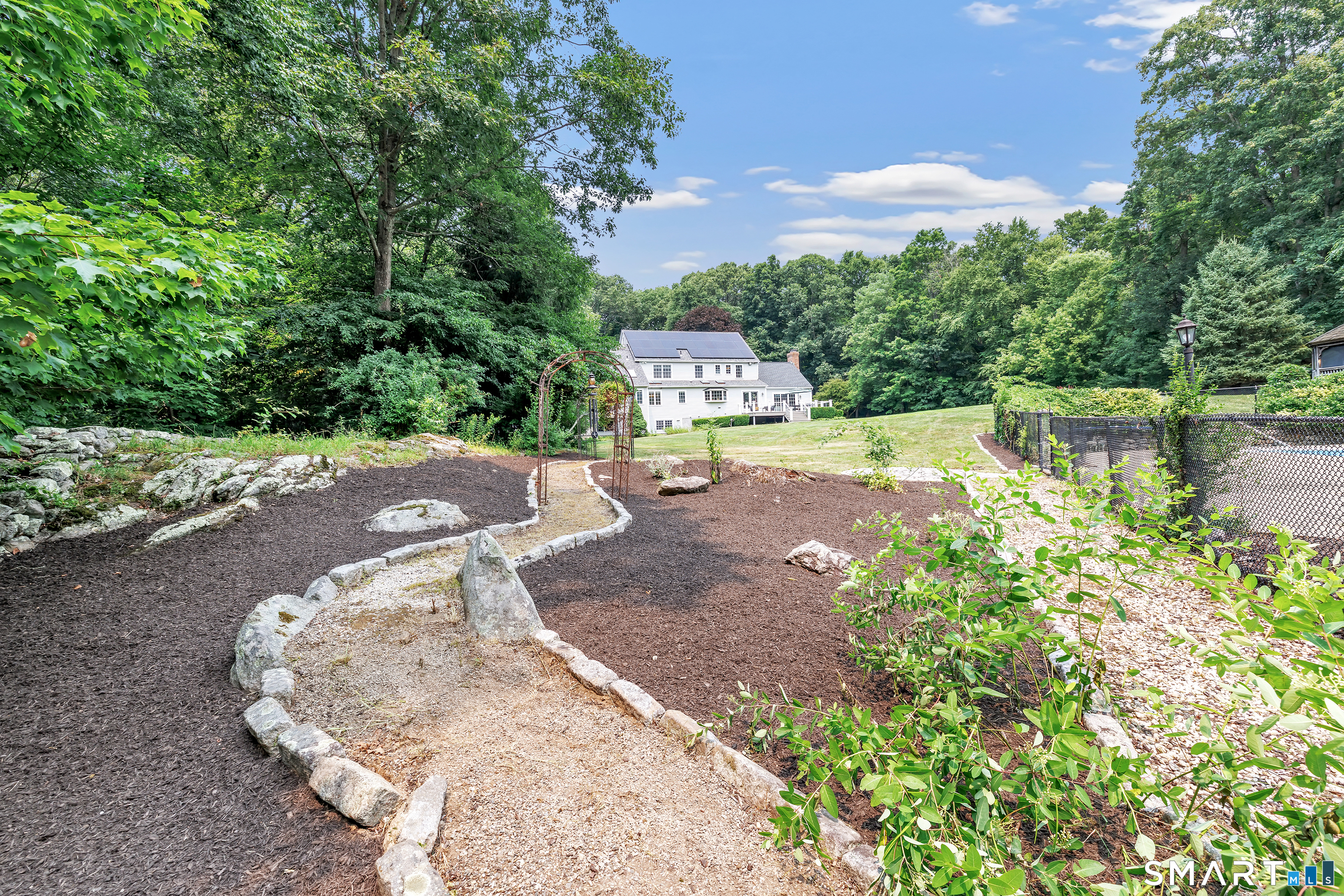 17 Plumtrees Road Newtown, CT 06470 - Photo 3 of 40 The view from the rock garden next to the in-ground pool