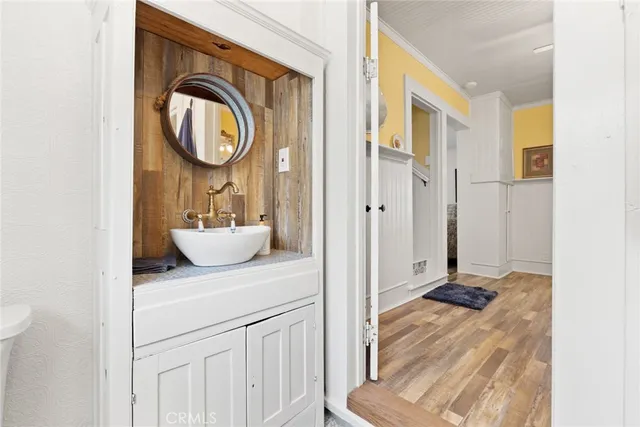 a living room with a bed furniture and a window
