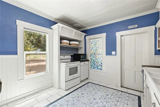 a kitchen with a stove and a refrigerator