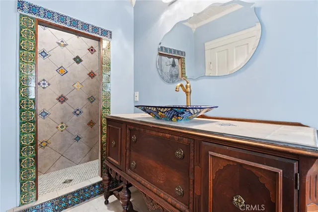 a bathroom with a sink and a mirror