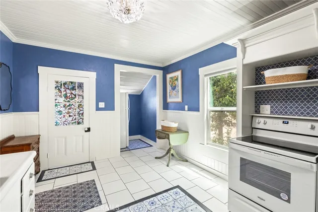 a bath room with a window and a table