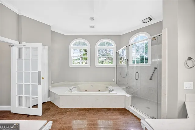 a bathroom with a double vanity sink a mirror and a shower