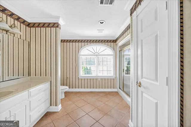 a view of a porch with wooden floor and a floor to ceiling window