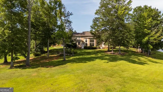 a view of a swimming pool with a yard