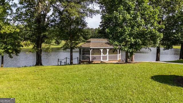 an aerial view of a house with swimming pool and outdoor space
