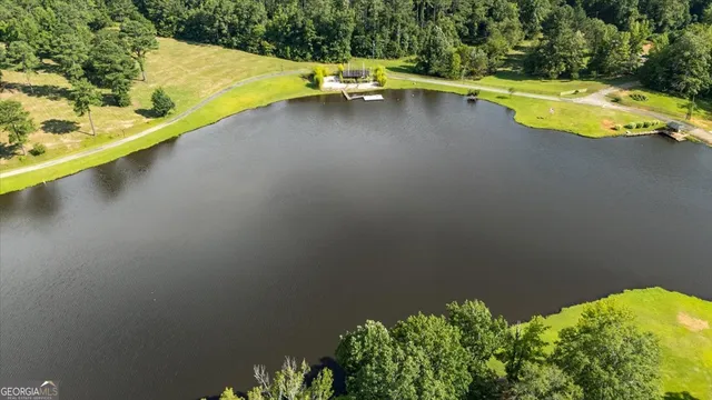 a view of a swimming pool with a yard