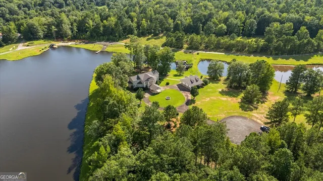 a view of a swimming pool with an outdoor seating and a yard