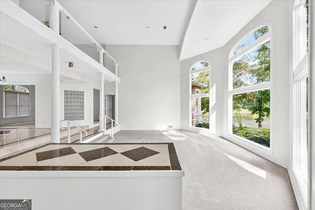 a view of a sink and dishwasher with wooden floor