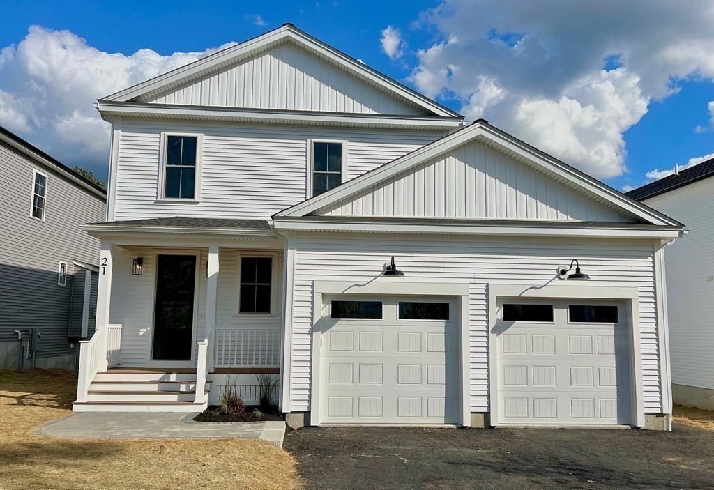 21 Quarry Road, Unit 21 Acton, MA 01720 - Photo 1 of 15 a front view of a house with a white door