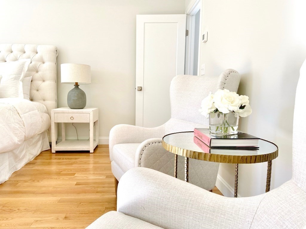 21 Quarry Road, Unit 21 Acton, MA 01720 - Photo 11 of 15 a living room with furniture and a chandelier