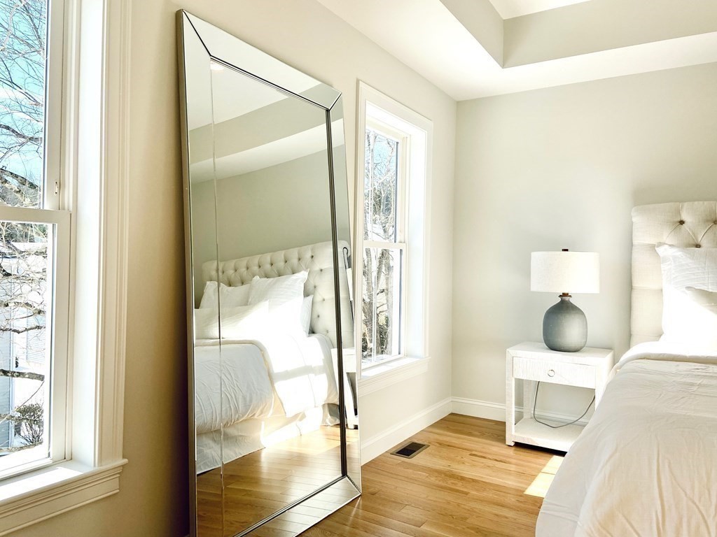 21 Quarry Road, Unit 21 Acton, MA 01720 - Photo 12 of 15 a bedroom with a bed and wooden floor