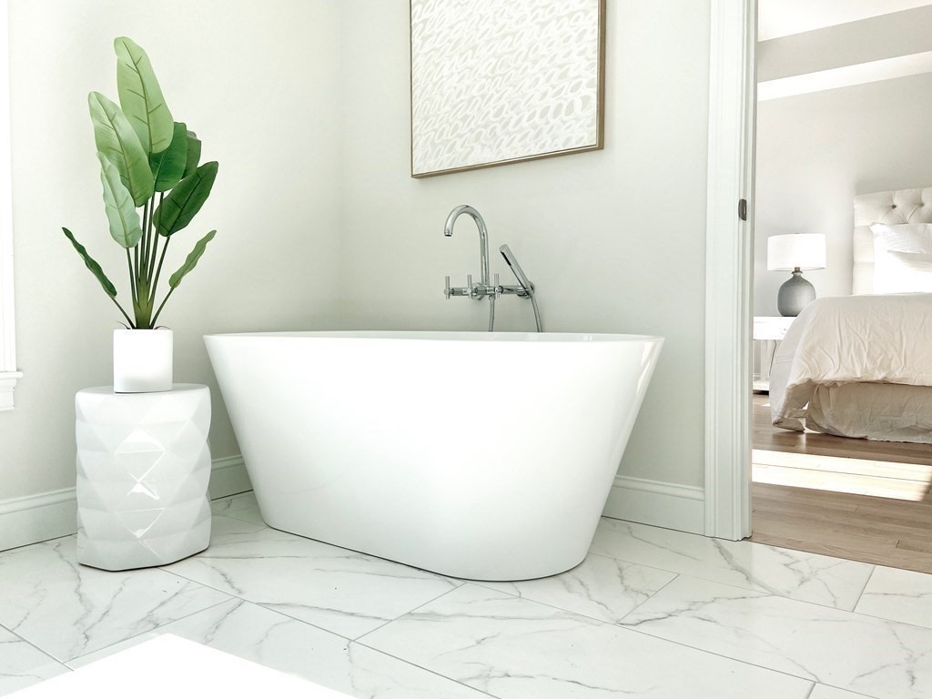 21 Quarry Road, Unit 21 Acton, MA 01720 - Photo 15 of 15 a white bath tub sitting in a bathroom