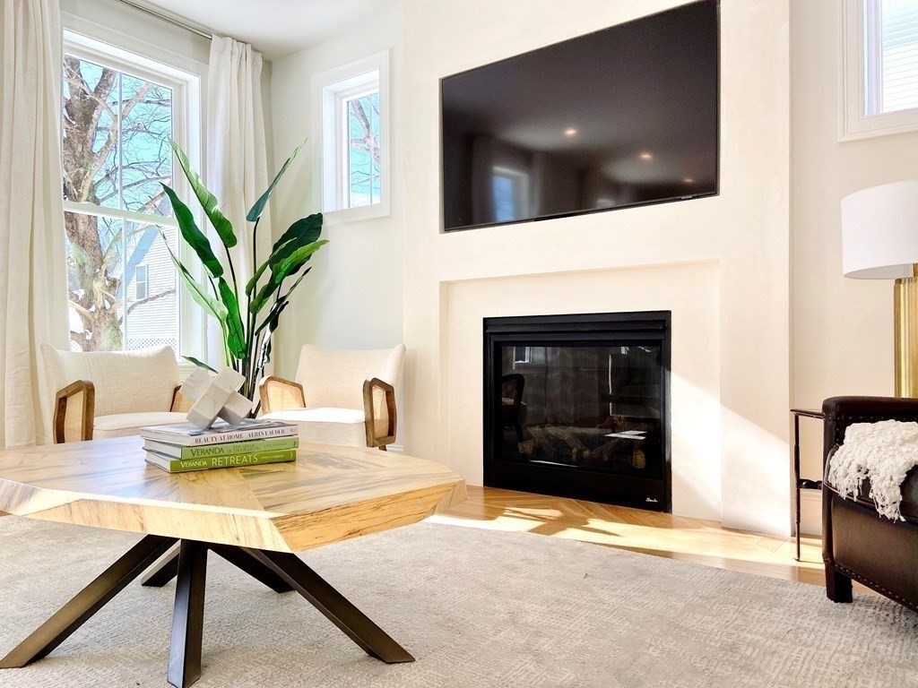 21 Quarry Road, Unit 21 Acton, MA 01720 - Photo 3 of 15 a living room with furniture and a fireplace