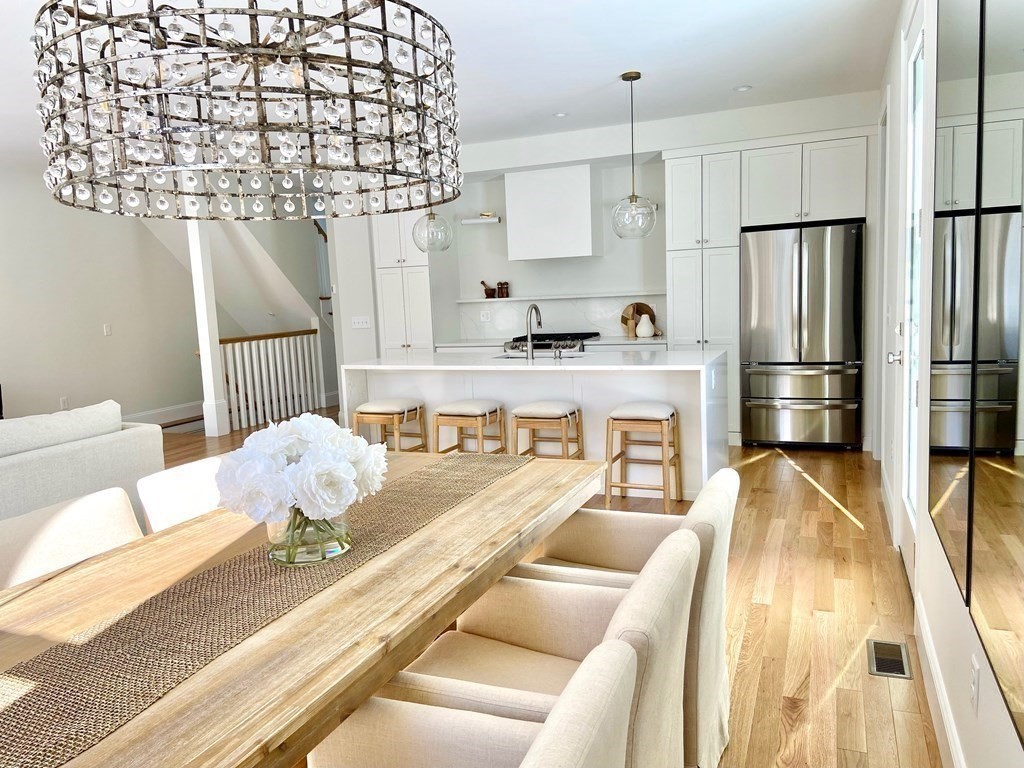 21 Quarry Road, Unit 21 Acton, MA 01720 - Photo 6 of 15 a living room with furniture and a chandelier