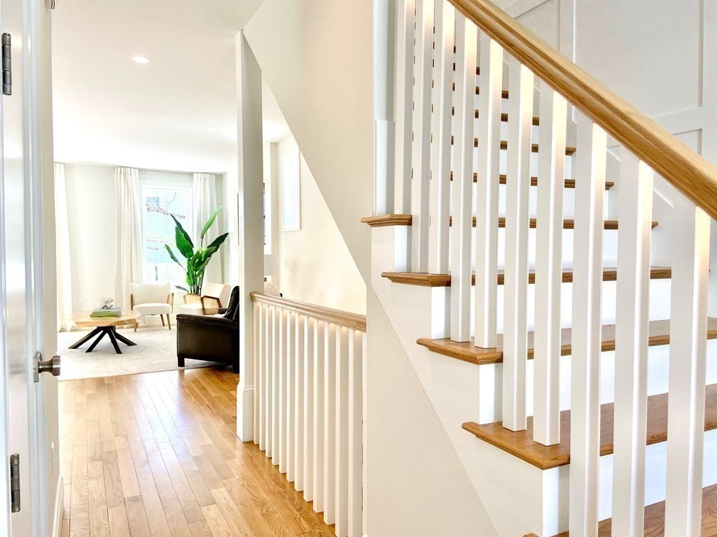 21 Quarry Road, Unit 21 Acton, MA 01720 - Photo 7 of 15 a view of staircase with wooden floor and furniture