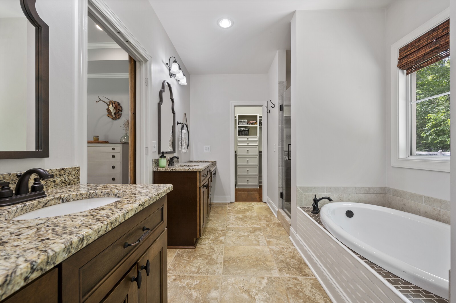 1082 Meeks Cemetery Road Burns, TN 37029 - Photo 14 of 26 a spacious bathroom with a granite countertop tub sink and mirror