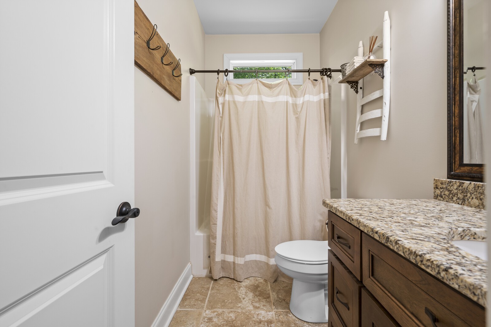 1082 Meeks Cemetery Road Burns, TN 37029 - Photo 19 of 26 a bathroom with a granite countertop sink toilet and shower