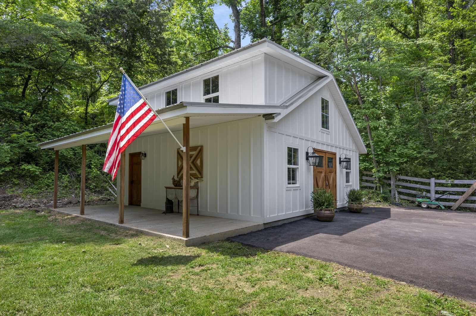 1082 Meeks Cemetery Road Burns, TN 37029 - Photo 22 of 26 a view of a house with backyard and trees