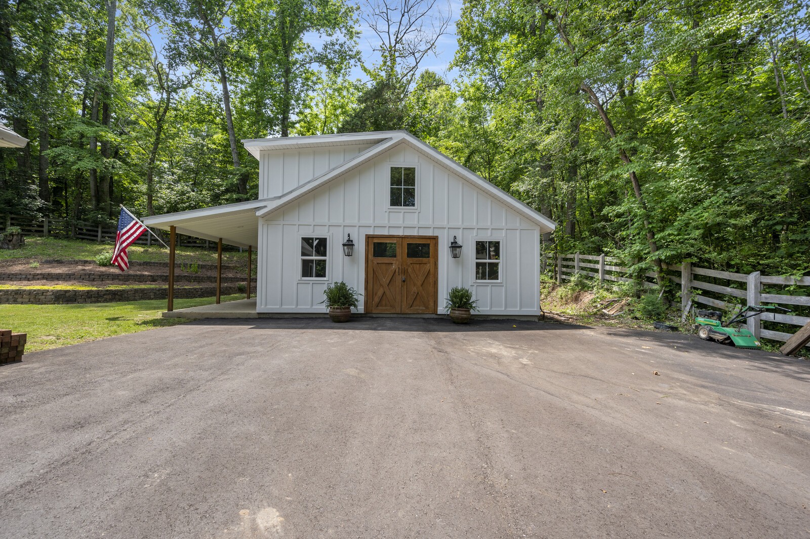 1082 Meeks Cemetery Road Burns, TN 37029 - Photo 23 of 26 a view of a house with a yard and large trees