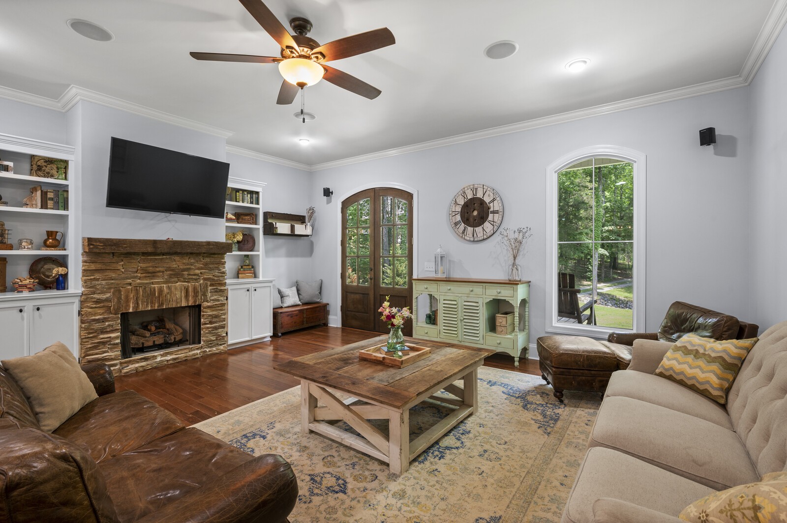 1082 Meeks Cemetery Road Burns, TN 37029 - Photo 4 of 26 a living room with furniture fireplace and a flat screen tv