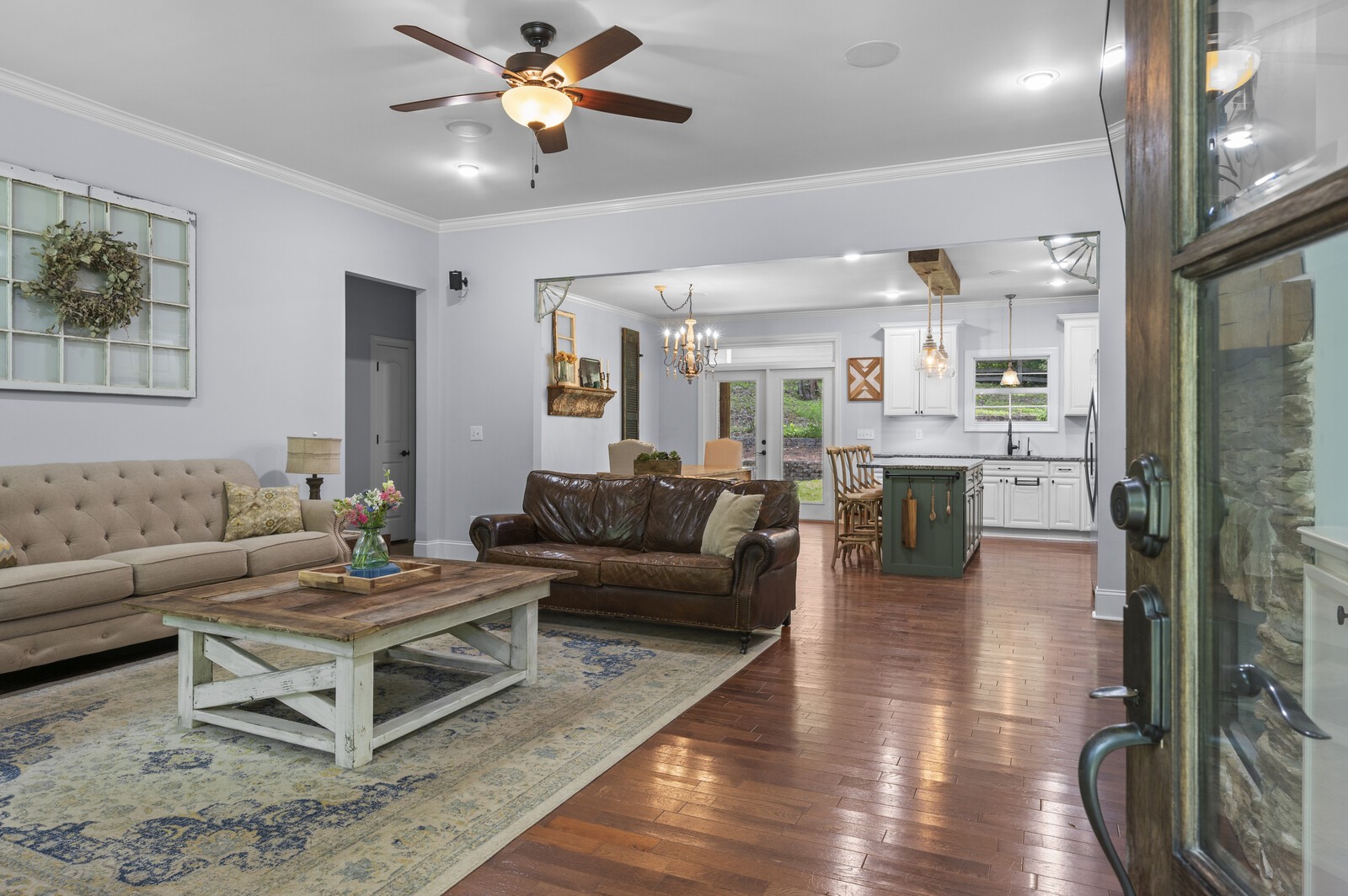 1082 Meeks Cemetery Road Burns, TN 37029 - Photo 7 of 26 a living room with furniture and a chandelier