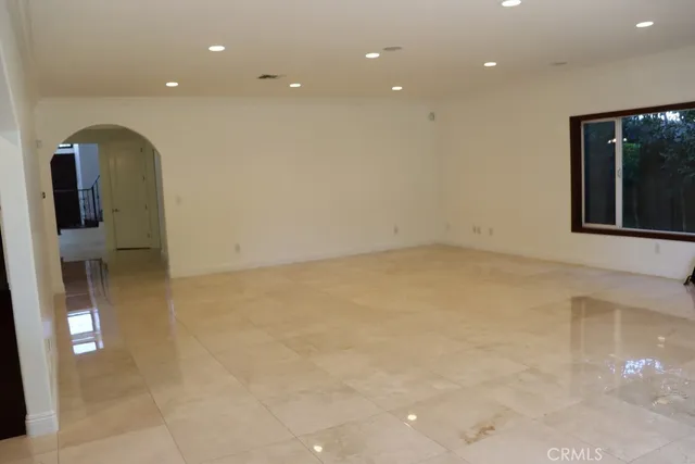 a view of a hallway and wooden floor
