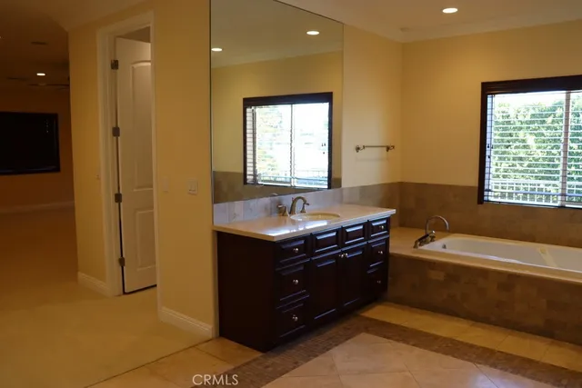 a view of hallway with wooden floor