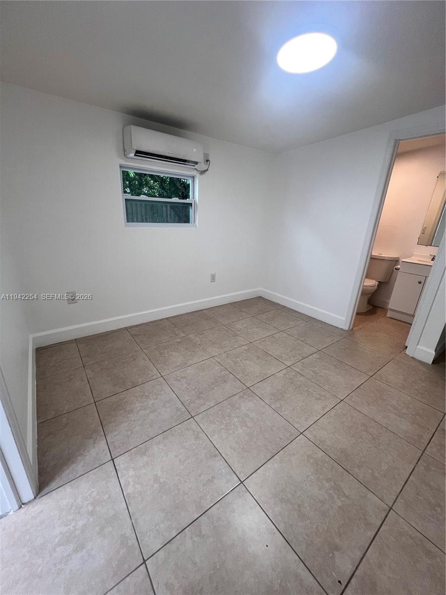 14763 Southwest 173rd Terrace, Unit 1 Miami, FL 33187 - Photo 11 of 23 an empty room with windows