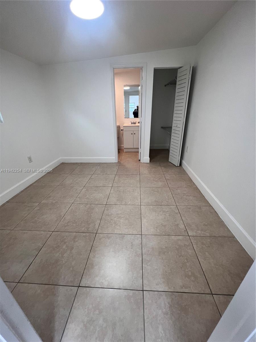 14763 Southwest 173rd Terrace, Unit 1 Miami, FL 33187 - Photo 13 of 23 a view of empty room