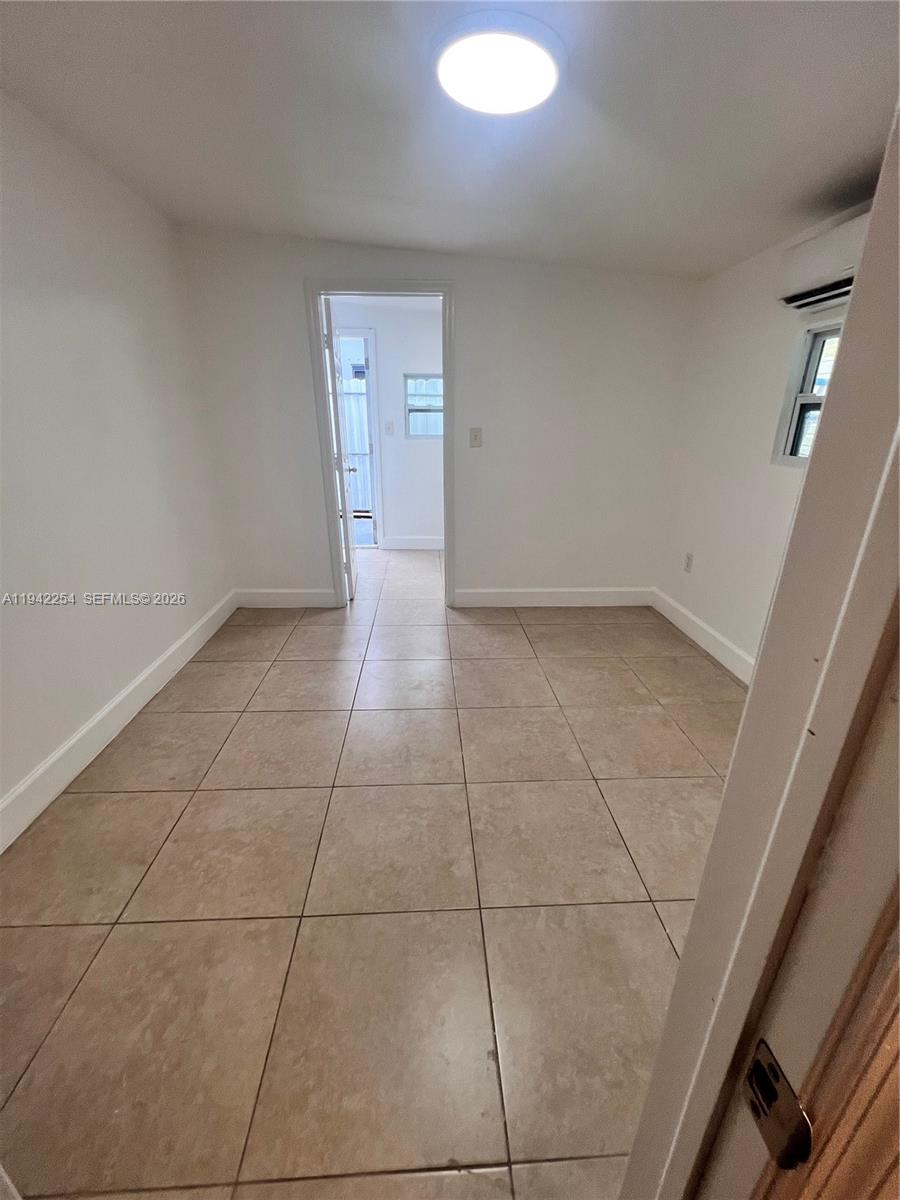 14763 Southwest 173rd Terrace, Unit 1 Miami, FL 33187 - Photo 15 of 23 a view of a livingroom with an empty space and a sink