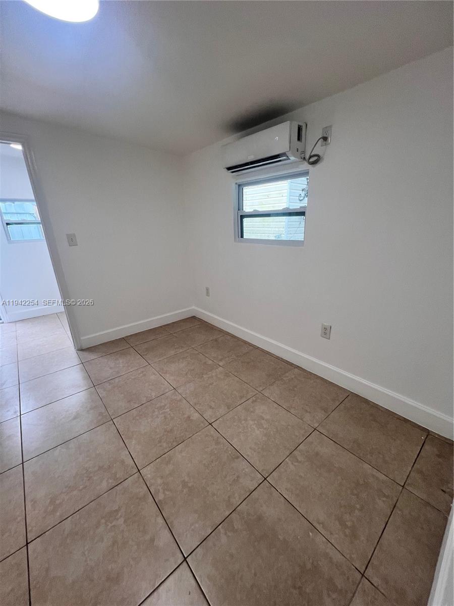14763 Southwest 173rd Terrace, Unit 1 Miami, FL 33187 - Photo 16 of 23 a view of room and window