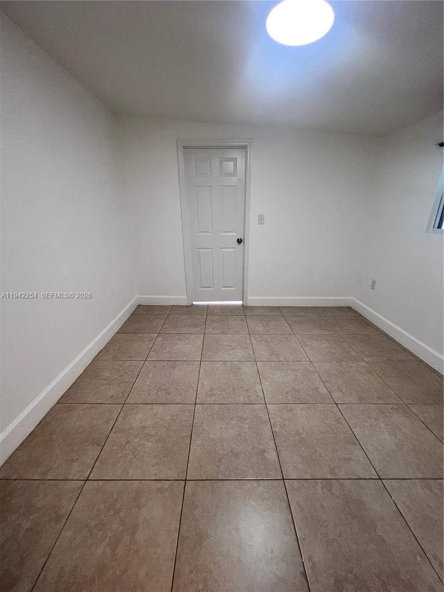 14763 Southwest 173rd Terrace, Unit 1 Miami, FL 33187 - Photo 18 of 23 a view of an empty room with a sink