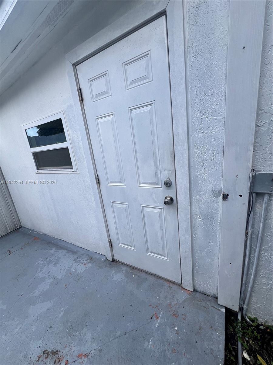 14763 Southwest 173rd Terrace, Unit 1 Miami, FL 33187 - Photo 2 of 23 a view of empty room with wooden floor