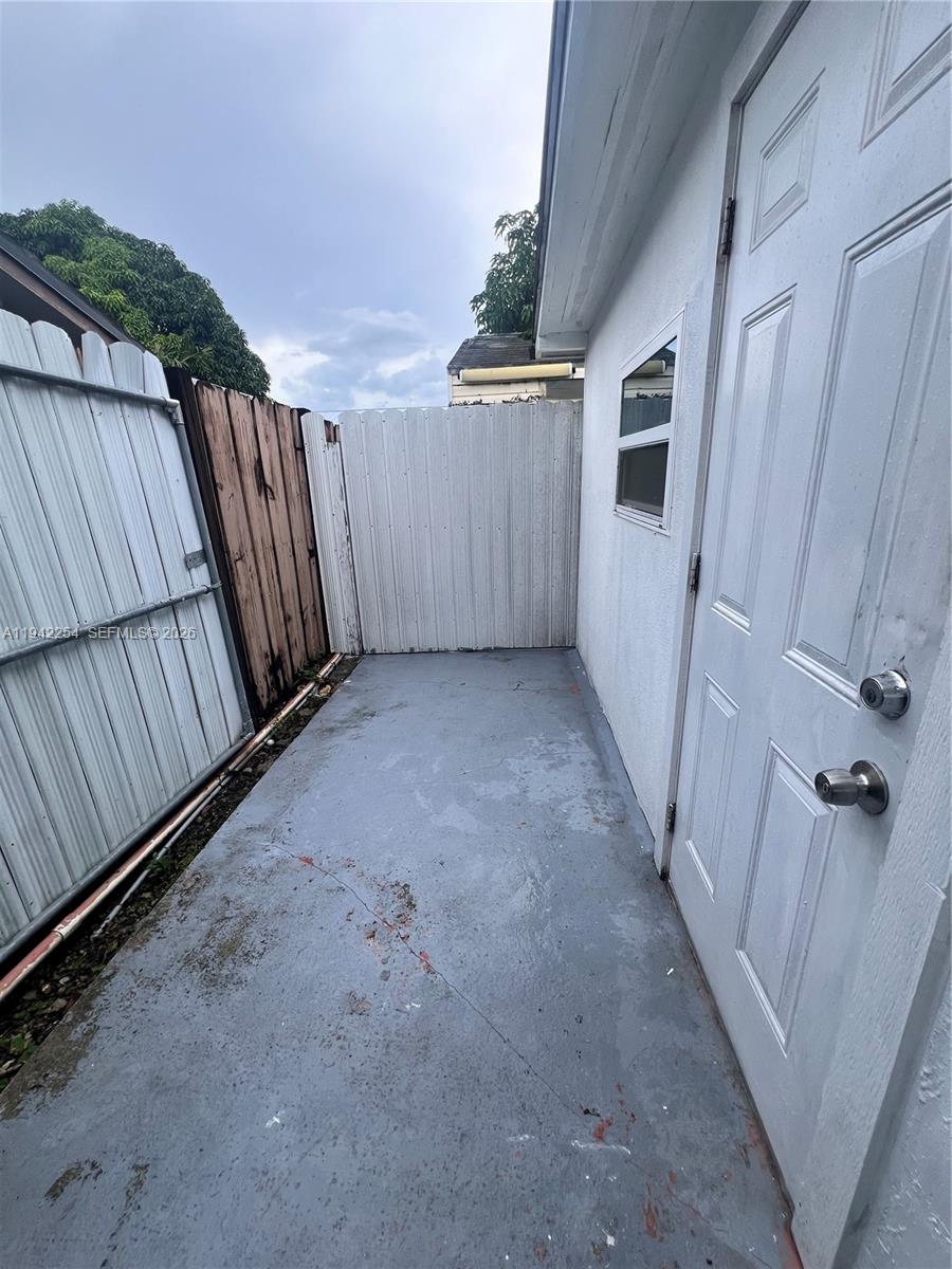 14763 Southwest 173rd Terrace, Unit 1 Miami, FL 33187 - Photo 3 of 23 a view of a garage