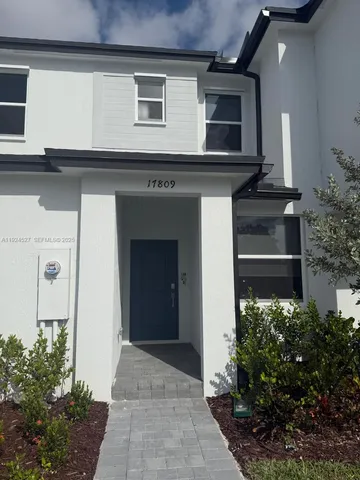 a front view of house with yard