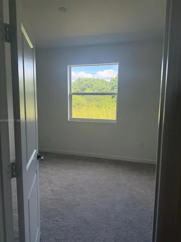 a view of hallway with windows