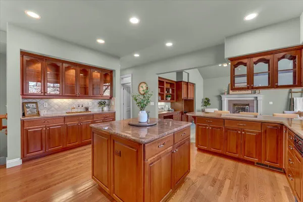 a kitchen with stainless steel appliances granite countertop a stove a sink dishwasher and a refrigerator