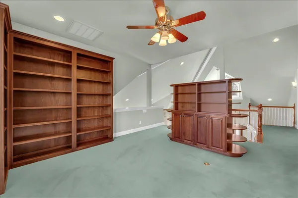 a view of an empty room with a cabinet