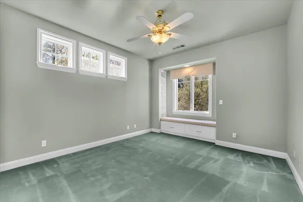 a view of an empty room with a window