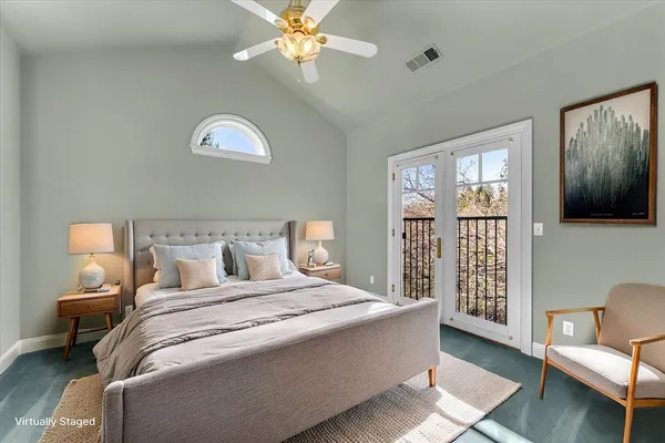 a bedroom with a large bed and a couch