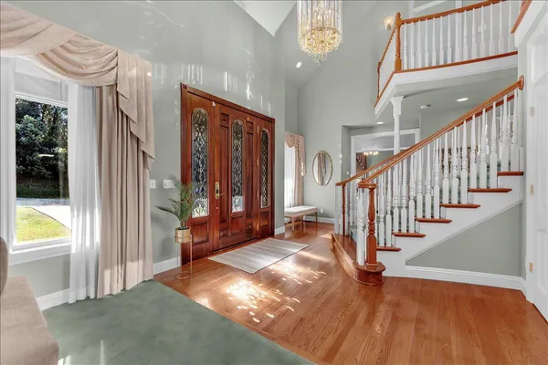 a view of an entryway with wooden floor