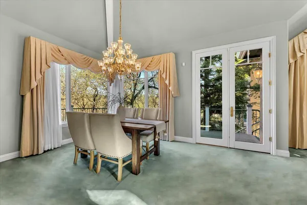 a dining room with furniture and window