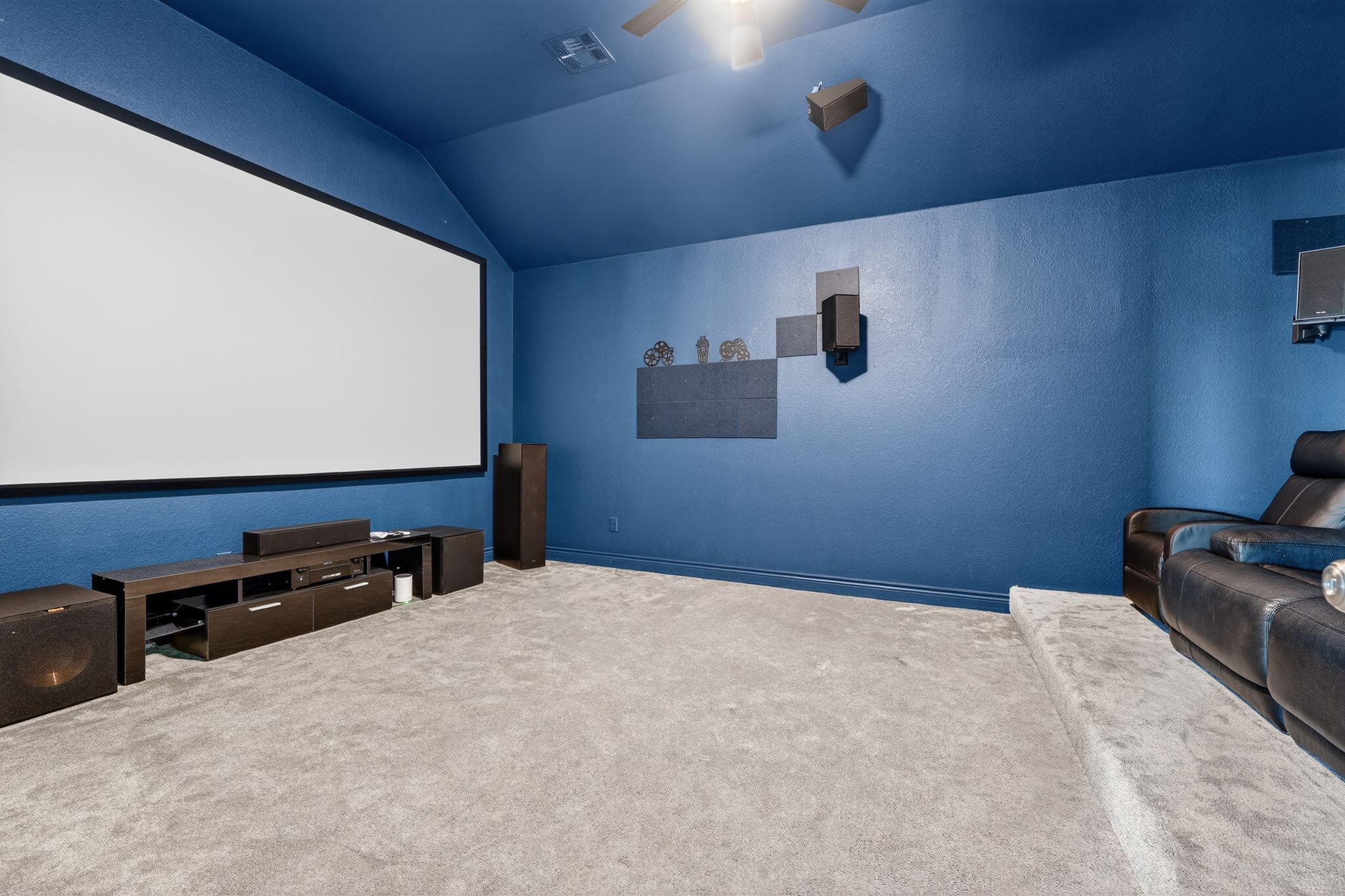 400 Cortona Lane Georgetown, TX 78628 - Photo 33 of 40 Carpeted cinema room with lofted ceiling and a ceiling fan