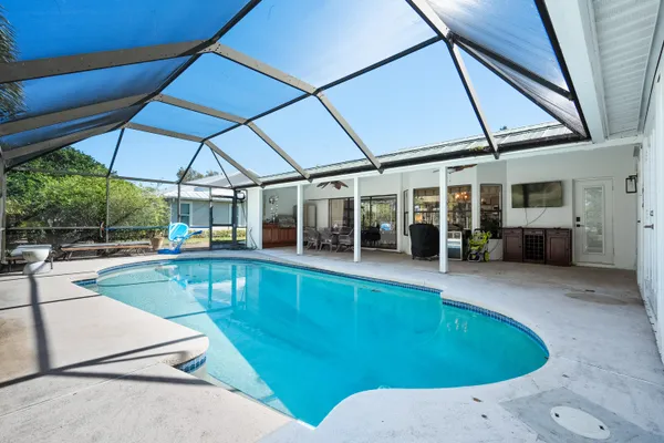 a view of a swimming pool with a patio